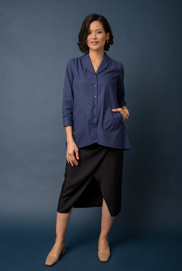 The tunic features two pockets on the front that are close to the hem.