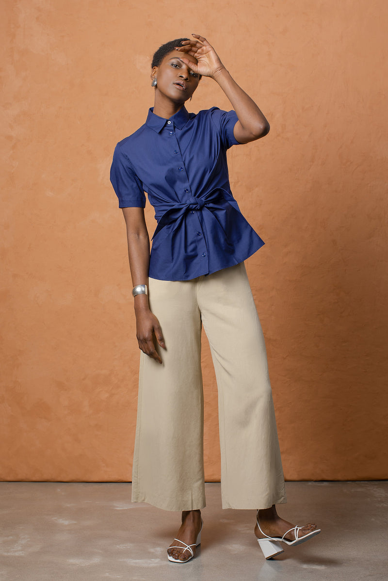 The button-down features a pointed collar and has a slight puff to each sleeve.