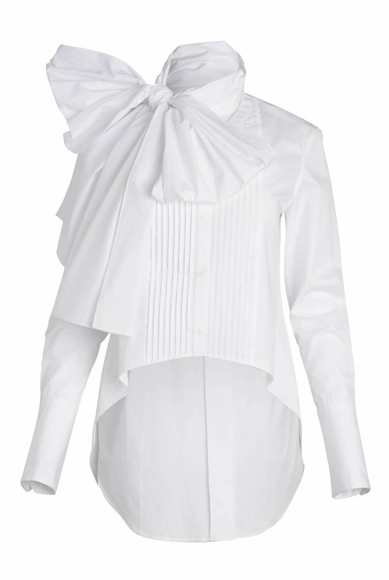 The white poplin tuxedo shirt has buttons down the center, a neck tie that can be made into a bow or styled in different ways, and a pleated bib.
